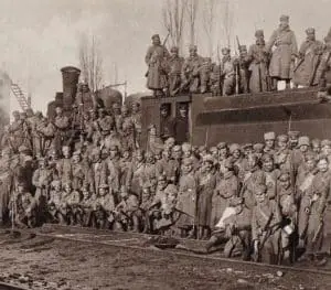 Soldiers from the Czech Legion posing near a rail car.