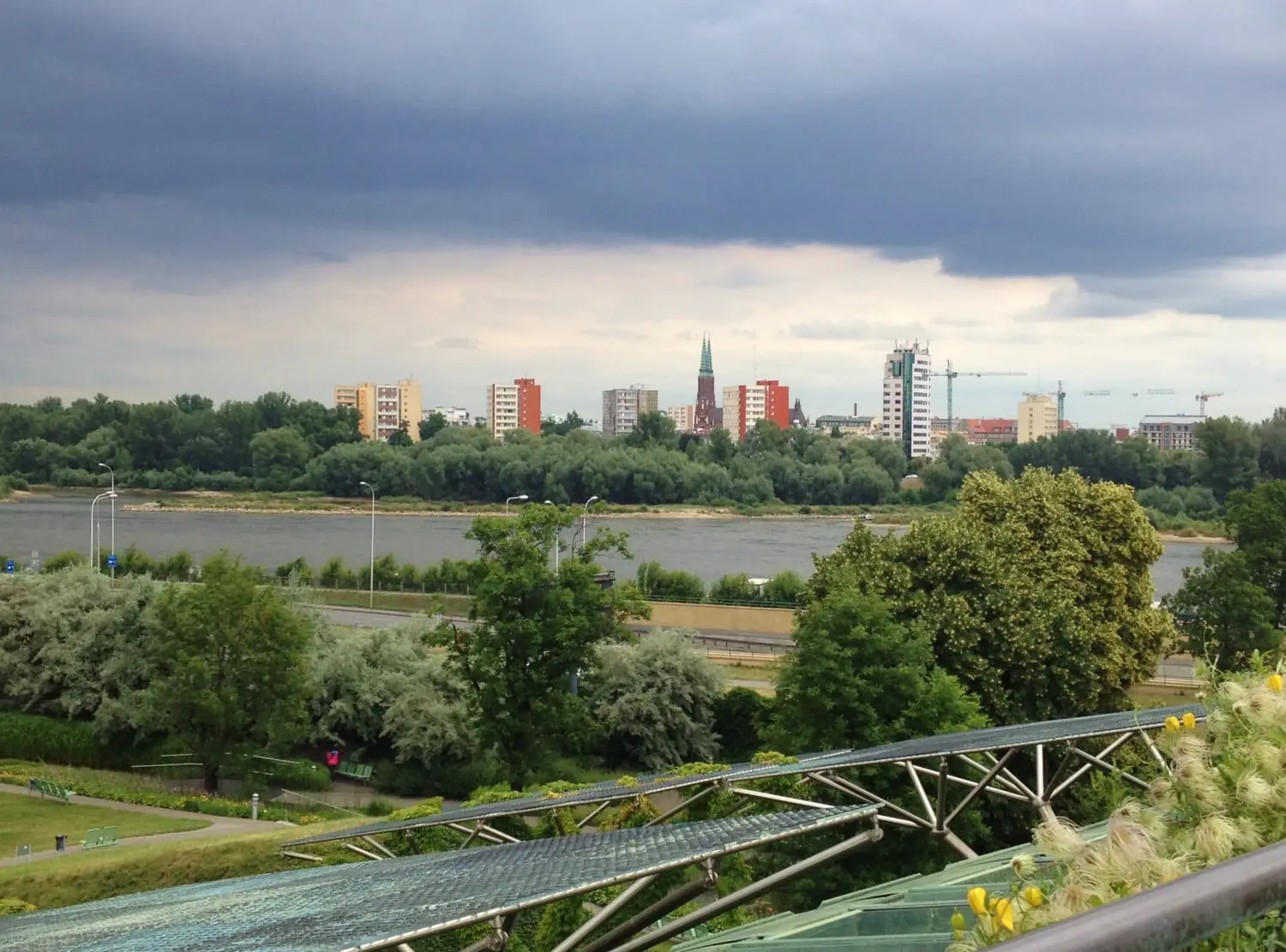 From the library's green roof, one can see across the river to Praga and the solar panels surrounding the building